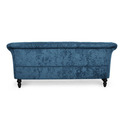 Divano a due posti in velluto con braccioli svasati e seduta profonda